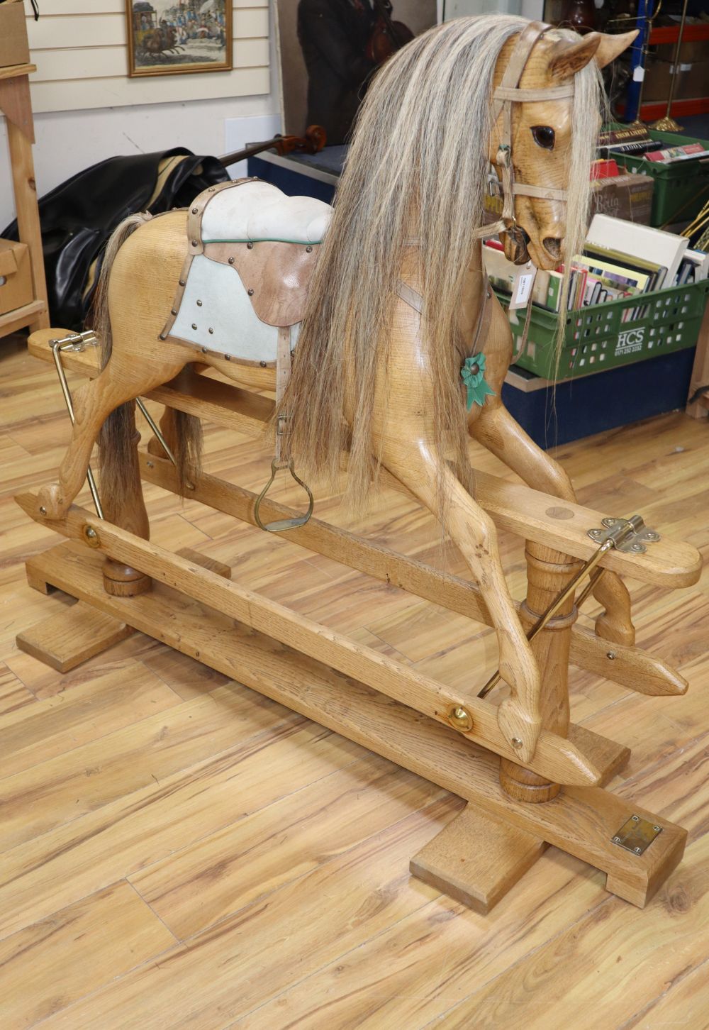 A carved natural oak rocking horse by Stevenson Bros, No 1075, 1992, L.140cm H.122cm